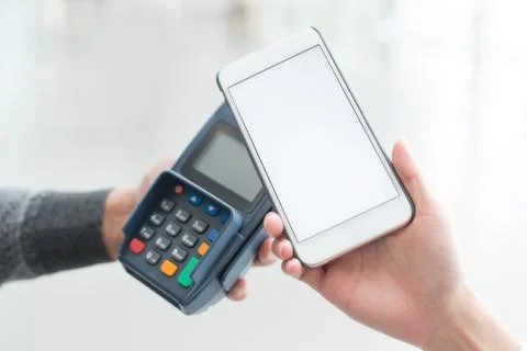 Customer pay by cellphone Stock Photos