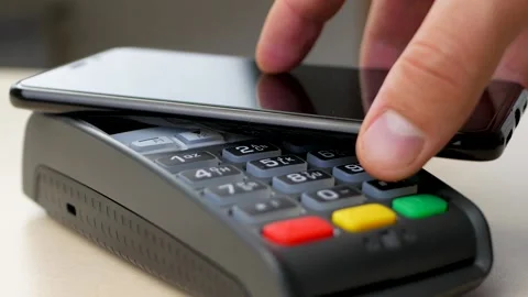 Customer pay by smartphone with NFC technology over distance Stock Footage 151433264