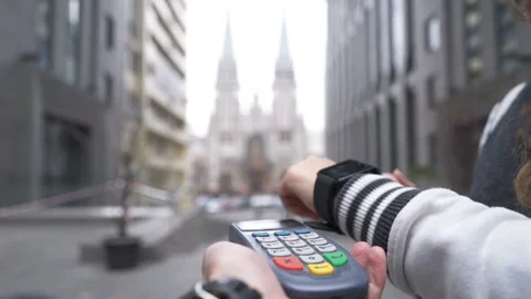 Customer paying with NFC technology by smart watch contactless on terminal Stock Footage 144620850