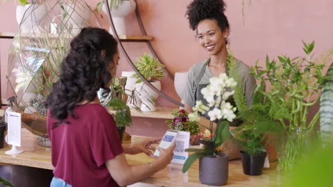 Customer paying with qr code for a bunch of flower Stock Footage 170367578