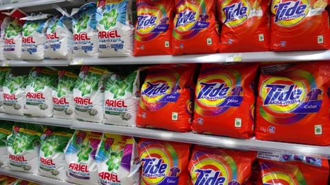 Customer picking up laundry detergent in supermarket Stock Footage 283760227