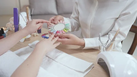 Customer point finger choosing artificial nails Video stock 120489967