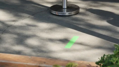 Customer practicing social distancing waiting in-line at the grocery store Video stock 131001946