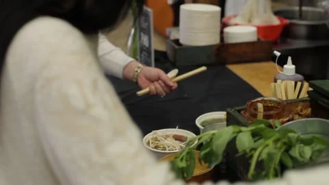 Customer Prepares Bowl With Fresh Herbs and Bean Sprouts at Sydney Market Food Stock Footage 345702880