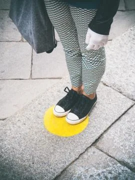 Customer queueing at safe distance and floor markings Stock Photos