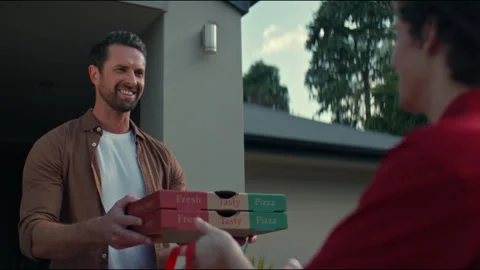 A customer receiving two boxes of pizza Stock Footage 263909062