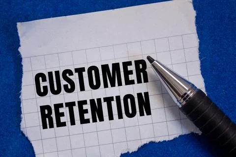 Customer Retention message written on ripped torn paper background. Concept.. Foto stock