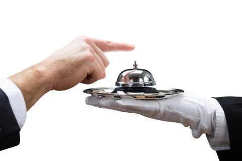 Customer Ringing Service Bell Held By Waiter Stock Photos