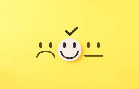 Customer Satisfaction Feedback Choice Concept. Smile face on wooden block Stock-Fotos