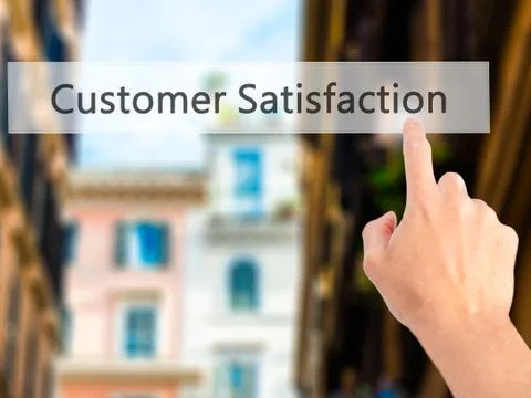 Customer Satisfaction - Hand pressing a button on blurred background concept  Stockfoto's