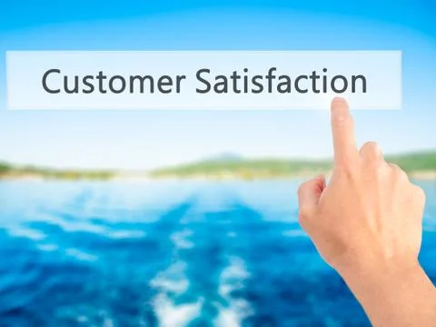 Customer Satisfaction - Hand pressing a button on blurred background concept  Foto stock