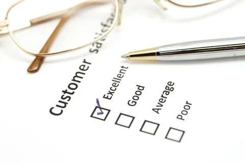 Customer satisfaction survey form with pen and eye glasses Stock Photos