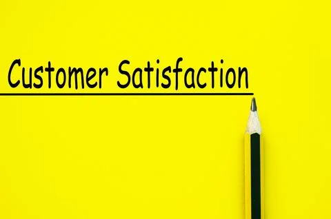 Customer satisfaction text written on yellow paper background. Customer foc.. Stock Photos