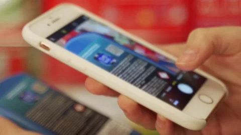 Customer scans qr-code and reads information on phone Stock Footage 202306765