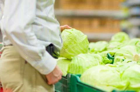 Customer select cabbage in supermarket Stock Photos