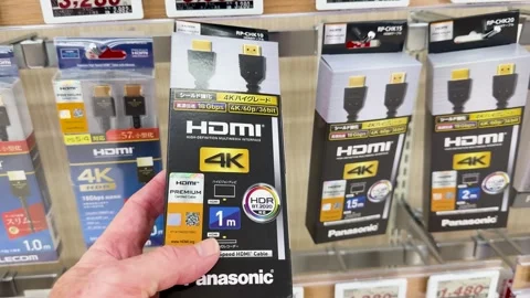 Customer Selecting a 4K HDMI Cable from a Retail Store Shelf Stock Footage 332828032