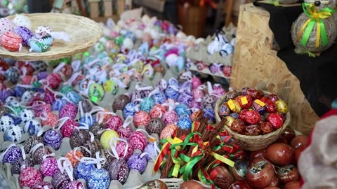 Customer selecting Easter eggs on market stall Stock Footage 331812148