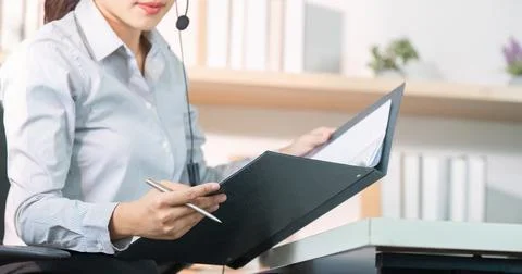 Customer Service Agent Organizing Client Documents During Call Stock Photos