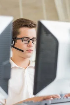 Customer service agent using computer Stock Photos