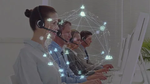 Customer service agents typing as 3D network fading and pulsing showing digital Stock Footage 314849179