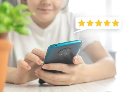 Customer service evaluation concept background, woman hand with mobile phone  Stock Photos