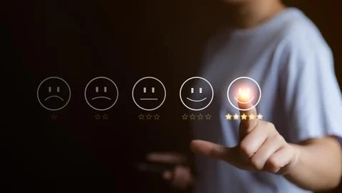 Customer service evaluation concept. User pressing smile face emoticon. Stock Photos