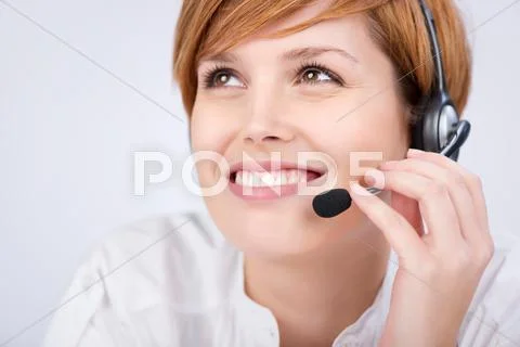 Customer service executive speaking on headset Stock Photos