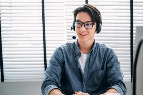 Customer service operator with headsets working at call centre Stock Photos