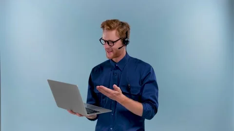 Customer service representative taking a call from a customer and smiling Stock Footage 201029315
