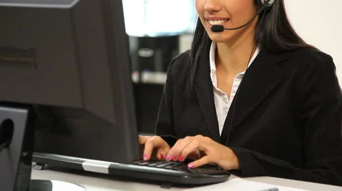Customer service representative talking with headset Stock Footage