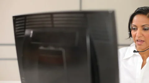 Customer service representative talking with headset 스톡 동영상 61671335