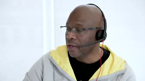 Customer service representative wearing headset is talking to client Stock Footage 305165341