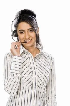 Customer service representative wearing headset and smiling Фото