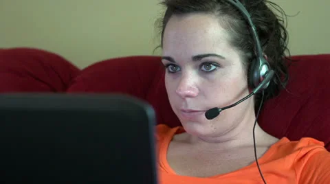 Customer service representative working form home laughing Vídeo Stock 24757492