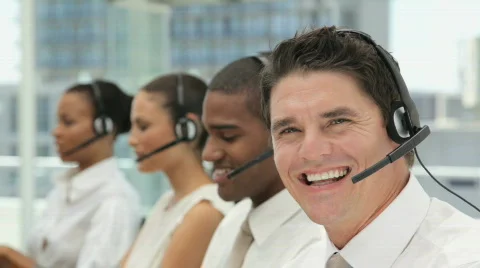 Customer Service Representatives Working on Their Headsets in Call Center Видео 853570