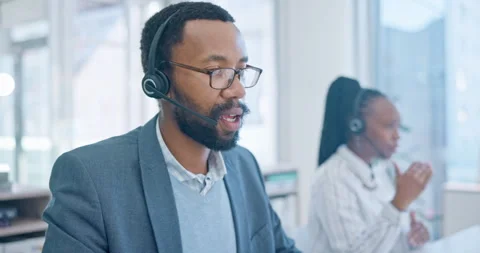 Customer service, support and a black man consultant talking in a call center Stock Footage 248043896
