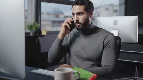 Customer service support talking with client on phone call discussing business Stock Footage 118589671