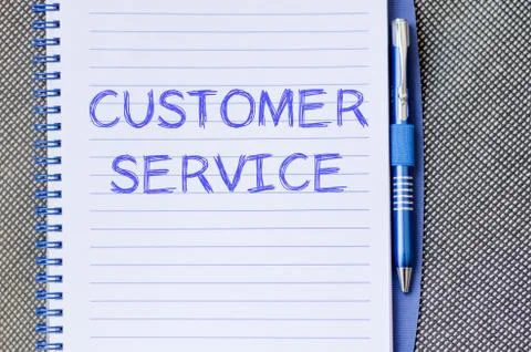 Customer service write on notebook Stock Photos