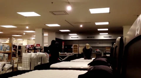 Customer shopping mattress inside Sears store Stock Footage 49508859