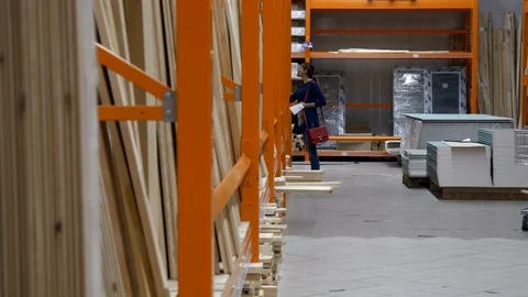 The customer stands in front of the shelf in the store Stock Footage 91061315