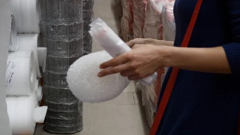 The customer stands in front of the shelf in the store Video stock 91062725