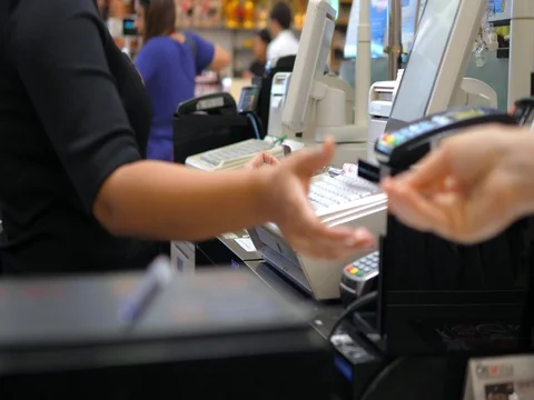 Customer At Supermarket Checkout Paying Using Credit Card Stock Footage 80426731