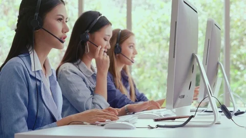 Customer support agent or call center with headset talking to customer on phone. Video stock 123185465