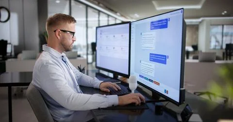 Customer Support Agent Works Efficiently Using Intelligent AI Chatbot Softwar Stock Photos