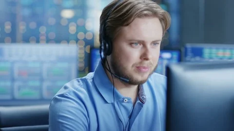 Customer Support Center Representative Makes Calls and Talks with Customer Stock Footage 80990030