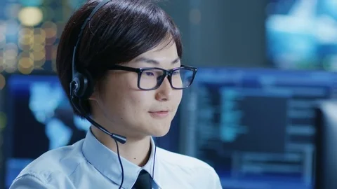 Customer Support Center Representative Makes Calls and Talks with Customer. Stock Footage 80990111