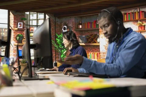 Customer support colleagues assisting clients needing help resetting password Stock Photos