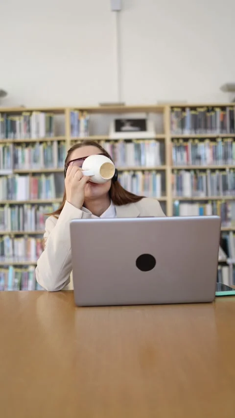 Customer support employee takes a coffee break during a busy shift Stock Footage 342179054