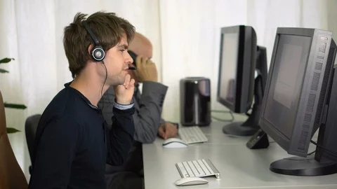 Customer Support Employees With Headset Turning To Camera and Smiling Stock Footage 113277347