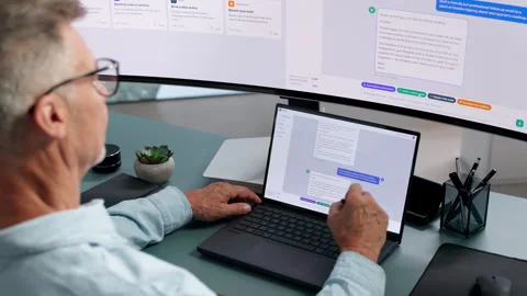 Customer Support Manager Assisting Clients Using AI Chatbot Software Stock Footage 345856940